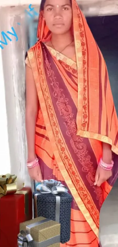 Traditional saree with vibrant colors and decorative gift boxes on wallpaper.