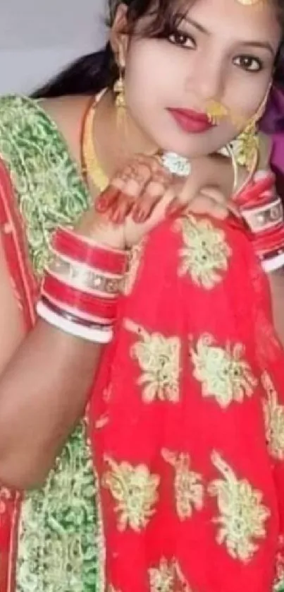 Woman in colorful traditional attire with red and green designs.