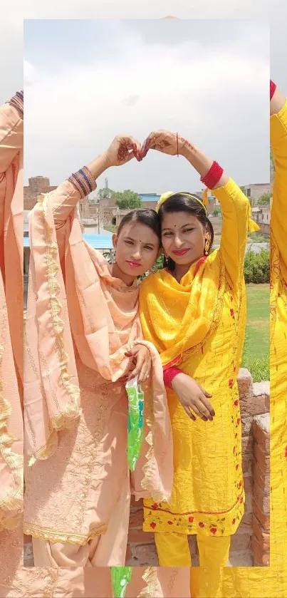 Women in vibrant traditional attire with scenic backdrop.