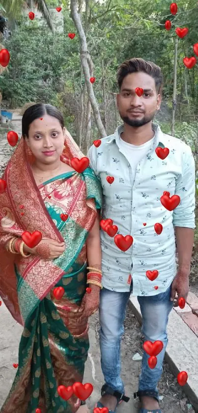 Traditional couple posing in nature with vibrant attire.