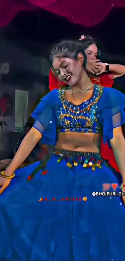 Traditional dancer in vibrant blue attire, smiling and posing gracefully.