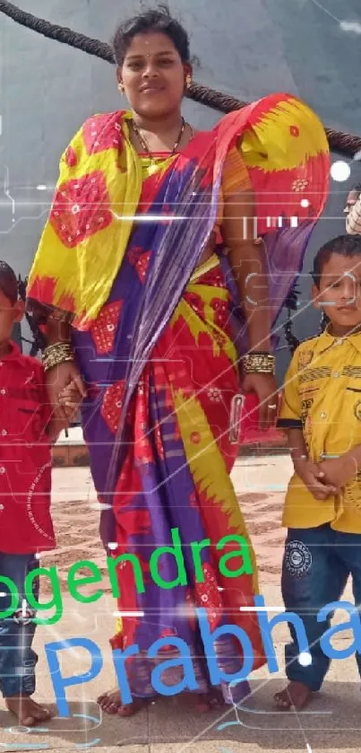 Family photo in vibrant traditional clothing with colorful saree.