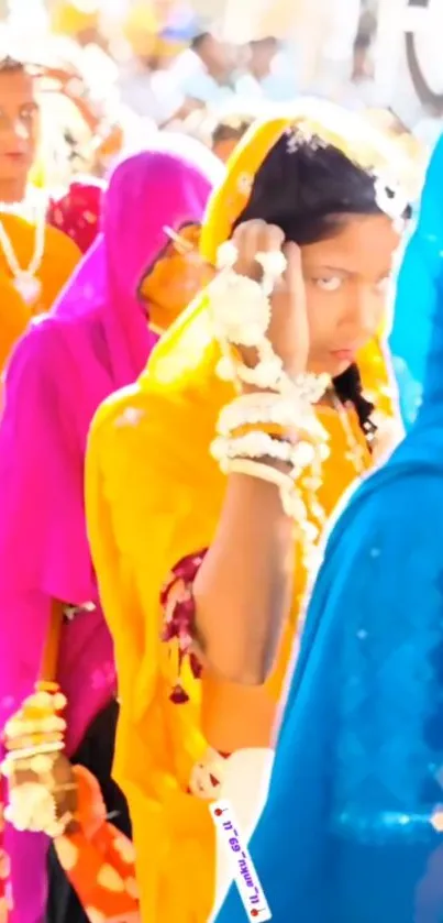 Women in vibrant traditional attire at a cultural festival.