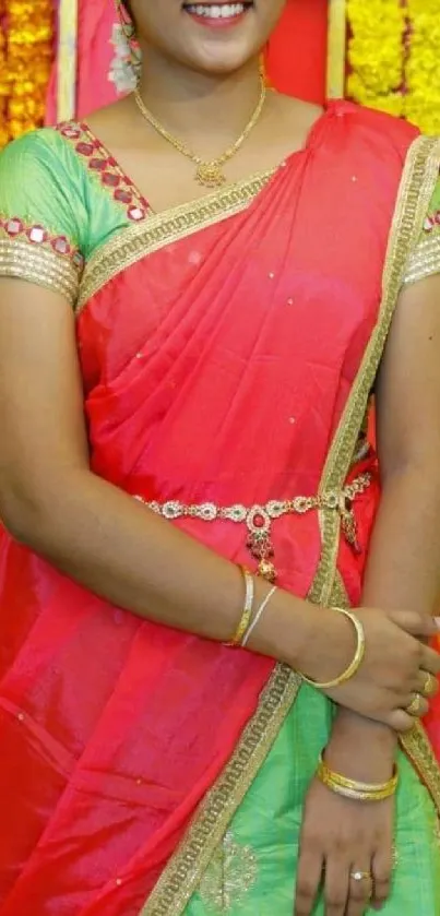 Person in a traditional Indian outfit with a vibrant, colorful background.