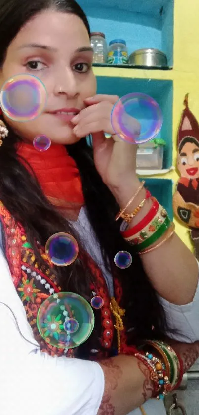 Woman in vibrant traditional attire with colorful background.