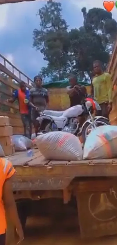 Truck journey with goods and people on a rural road.