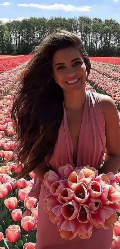 Woman holding tulips in a blooming field.