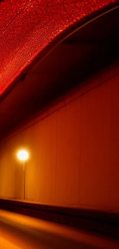 Vibrant orange-red illuminated tunnel wallpaper.