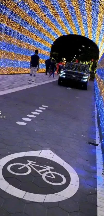 Car driving through vibrant blue and yellow light tunnel at night.