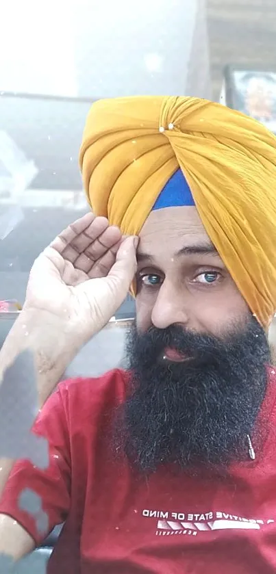 Portrait with vibrant yellow turban and beard.