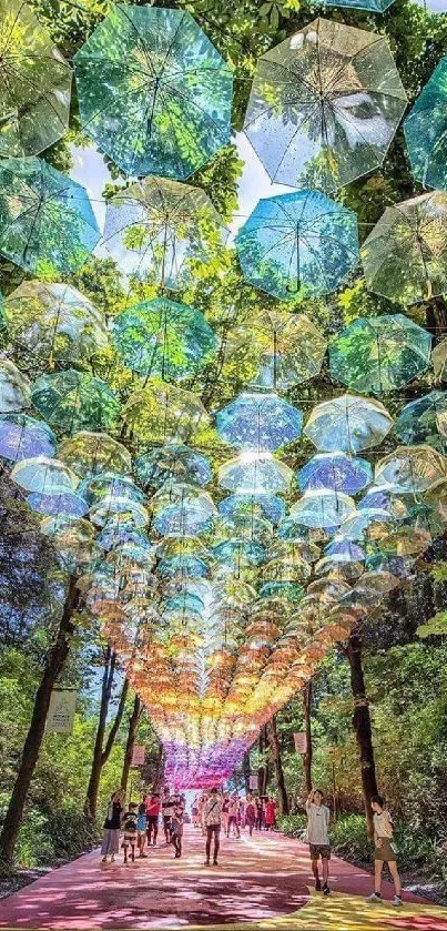 Vibrant pathway with colorful umbrella canopy in a forest setting.