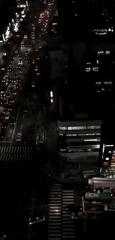 A vibrant city street illuminated at night with busy traffic and lights.