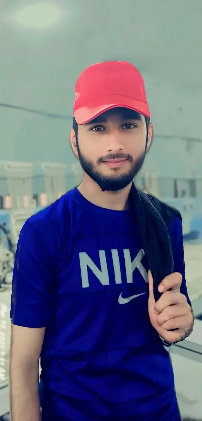 Vibrant urban portrait with red cap and blue shirt.