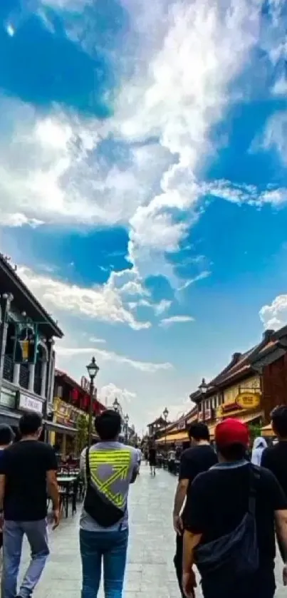 Group walking in vibrant urban street under a blue sky.