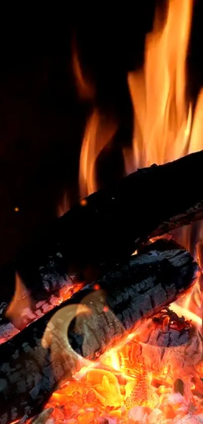 Mobile wallpaper of orange flames over dark logs, creating a cozy ambiance.