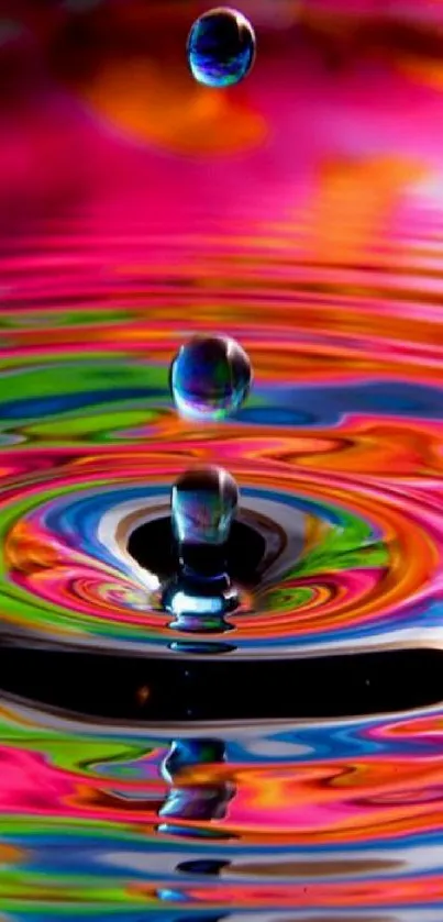 Colorful water droplet creating vibrant ripple effect wallpaper.