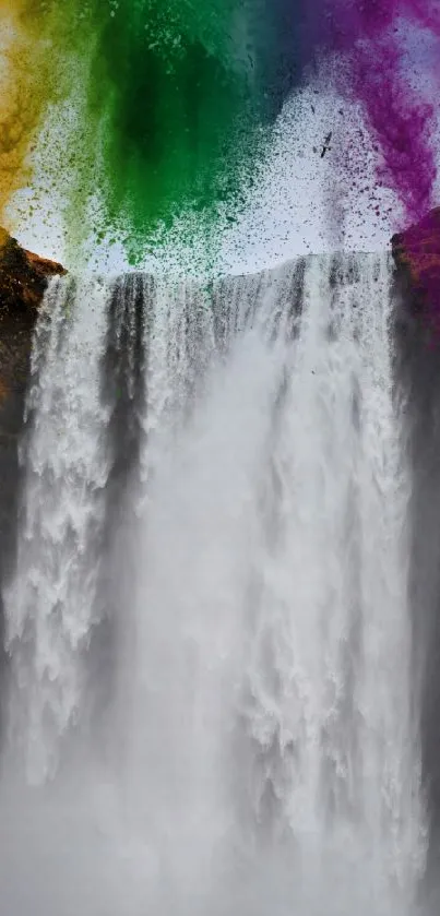 Vibrant waterfall with colored powder splashes, enhancing nature's beauty.