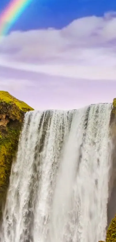 Waterfall with a rainbow in a vibrant nature scene.