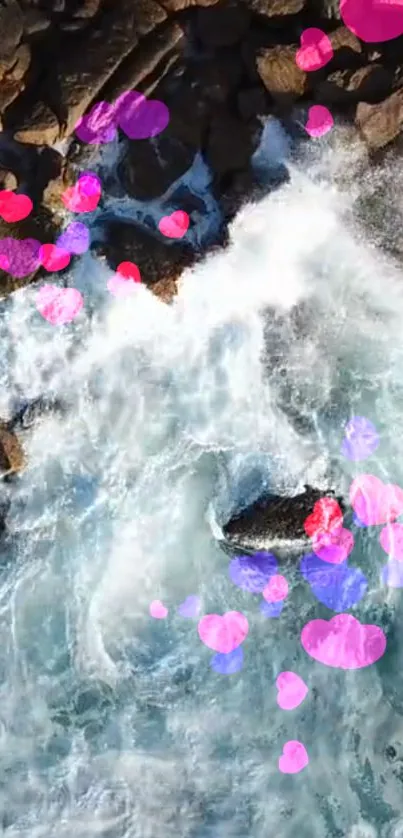 Aerial view of waves with vibrant heart overlays on a rocky shore.