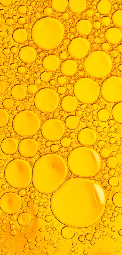 Yellow oil bubbles create a bright and vibrant phone wallpaper design.