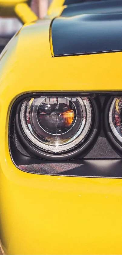 Yellow sports car headlight mobile wallpaper.