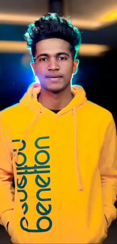 Man in a bright yellow hoodie with vibrant background.