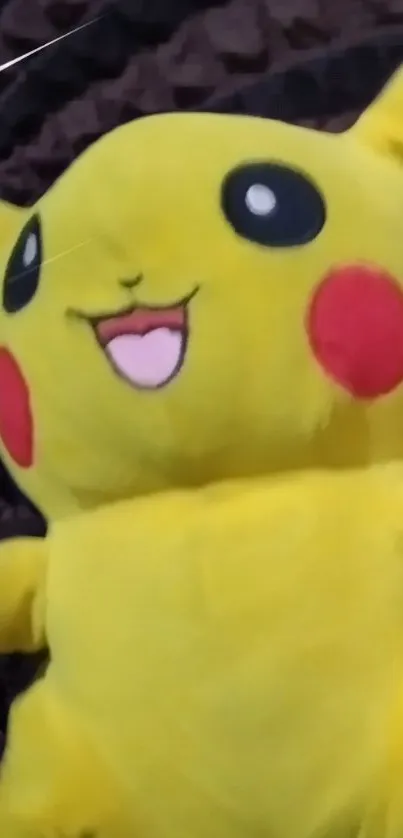 Vibrant yellow plush character with a happy expression.