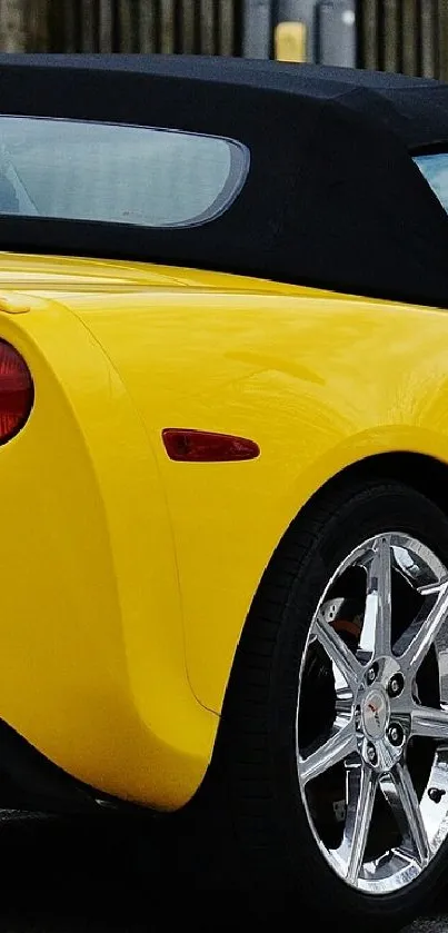 Vibrant yellow sports car on the road.
