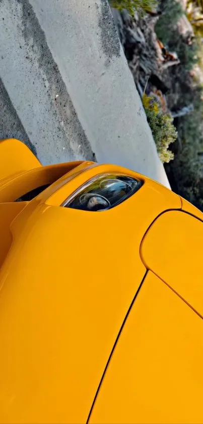 Yellow sports car parked on a road