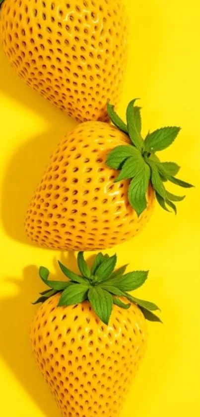 Three yellow strawberries on a vivid background.