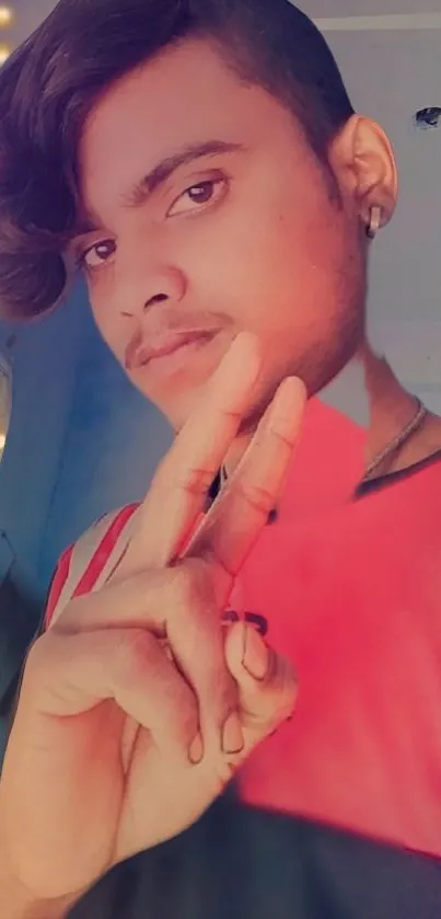 Portrait of a young person with peace sign and colorful background.