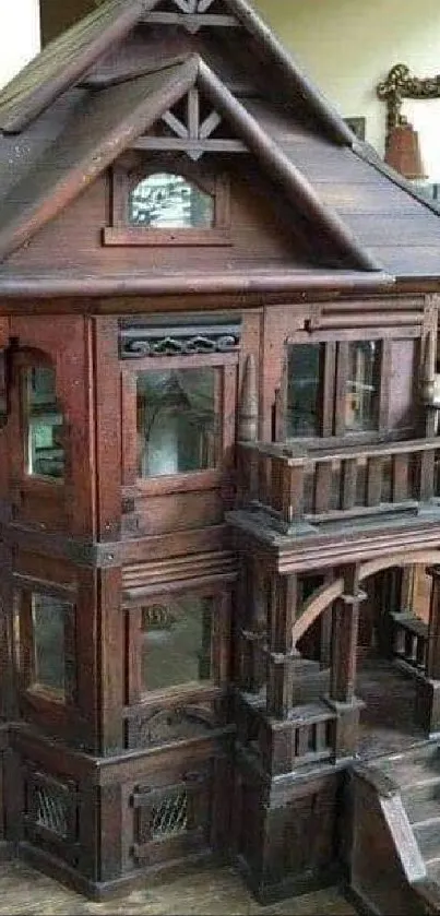 Intricate Victorian wooden dollhouse with detailed architecture.