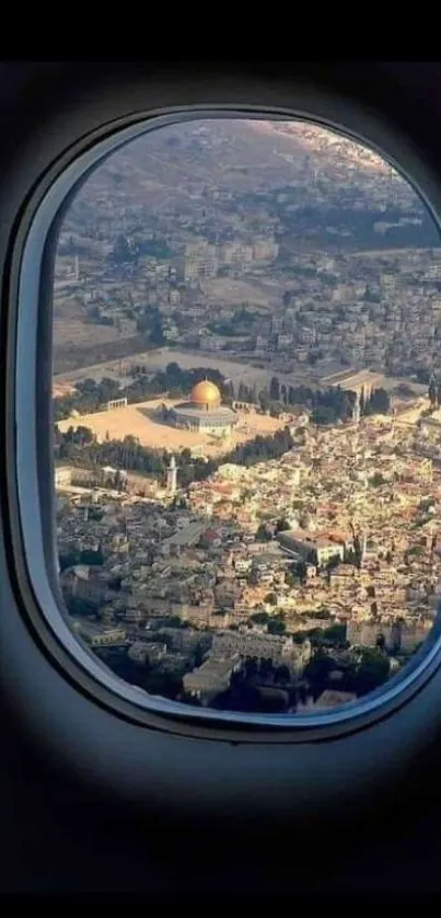 Aerial view of a city through an airplane window.