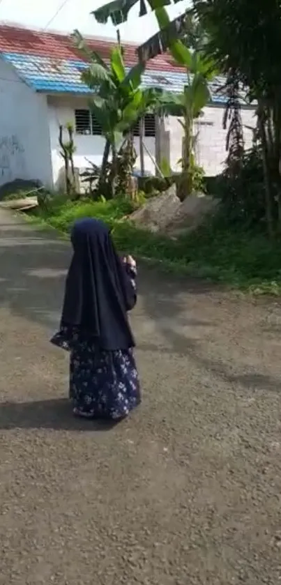 Child walking in a village setting with greenery.