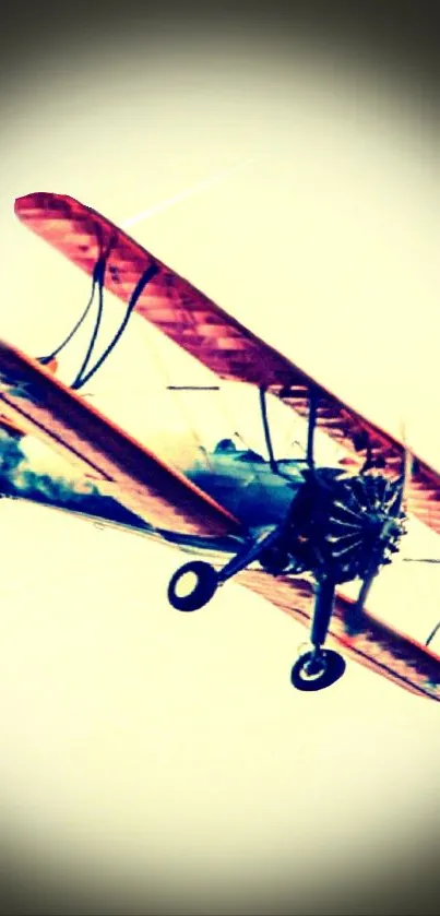 Vintage biplane soaring in a beige sky.