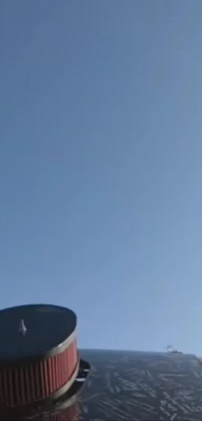 Vintage airplane against clear blue sky background.