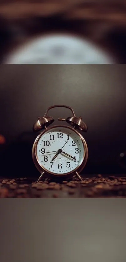 Vintage alarm clock on dark brown background.