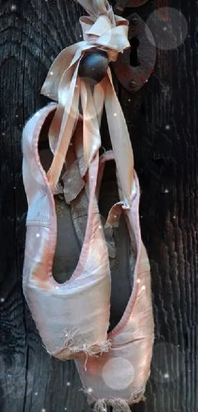 Elegant vintage ballet shoes on wooden background wallpaper.