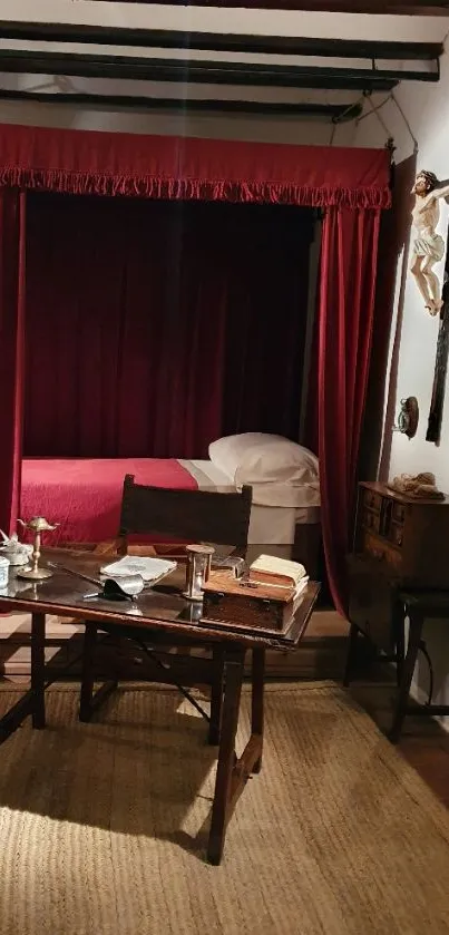 Vintage bedroom with red velvet curtains and wooden desk.