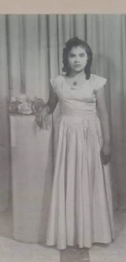 Vintage black and white portrait of a woman in a frame with elegant curtains.