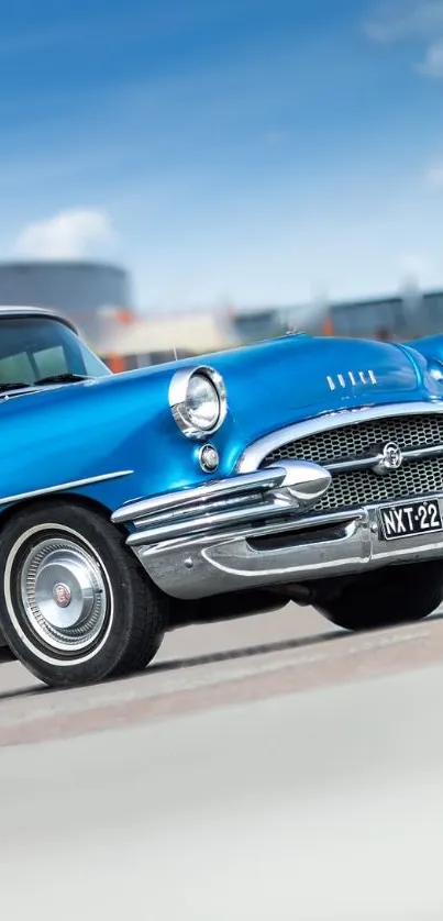 Classic blue vintage car on a bright sunny day wallpaper.
