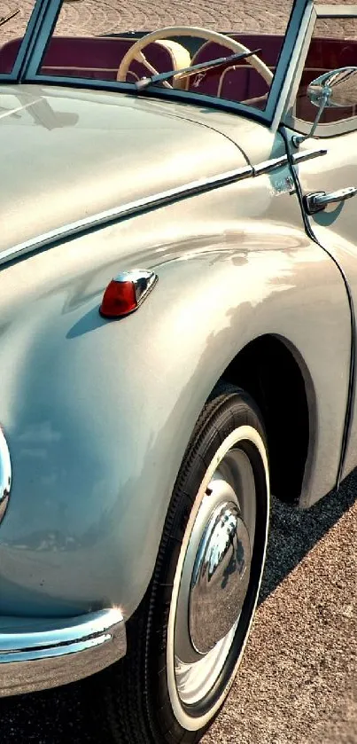 Elegant vintage convertible car in blue-gray shade.