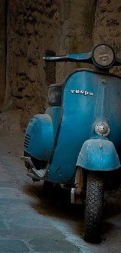 Vintage blue Vespa scooter against rustic wall background.