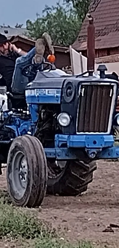 Vintage blue tractor parked in a rustic farm setting, showcasing countryside life.