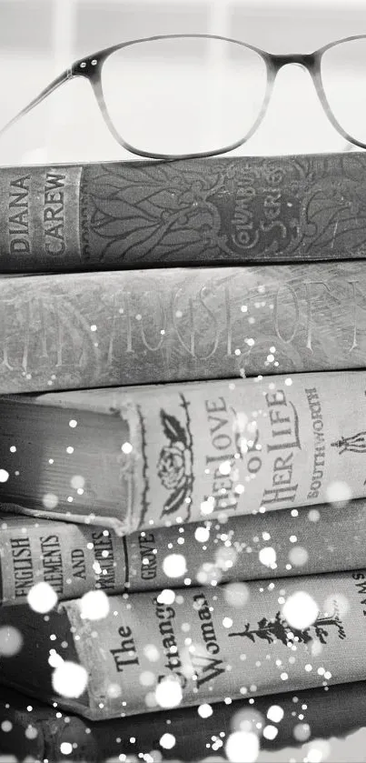 Black and white vintage books with glasses on top, dotted design.