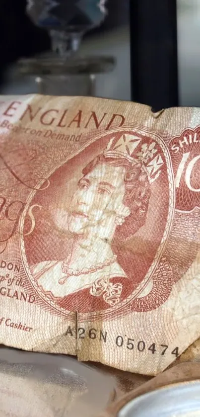 Vintage British 10 Shilling banknote wallpaper with intricate details.