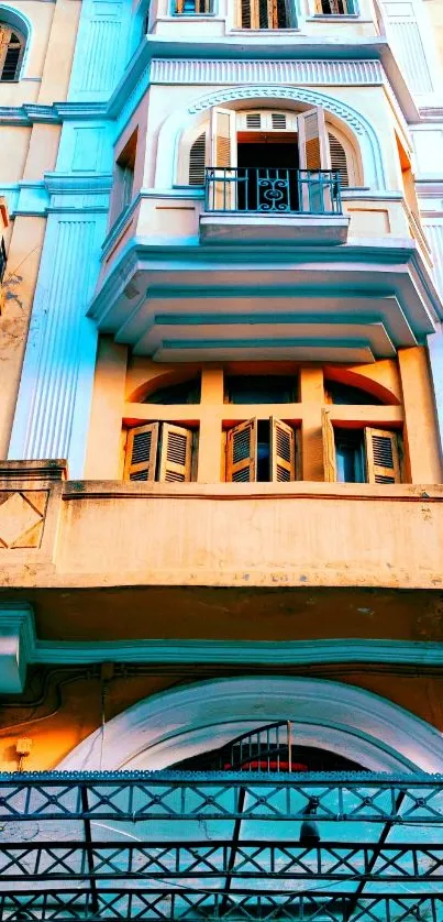 Vintage building facade with balustrades and arched windows in urban scenery.