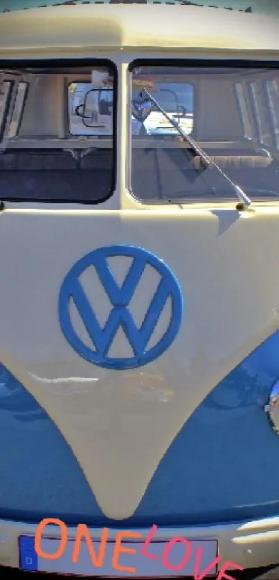 Vintage blue and white bus with 'ONELOVE' text.