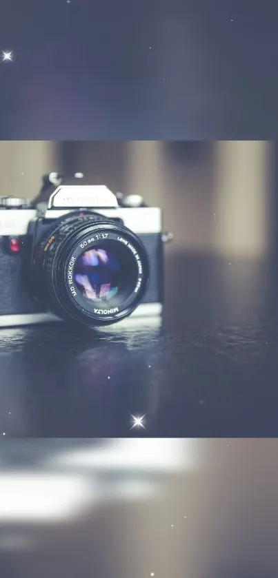 Vintage camera with dark blue background and soft focus effect.