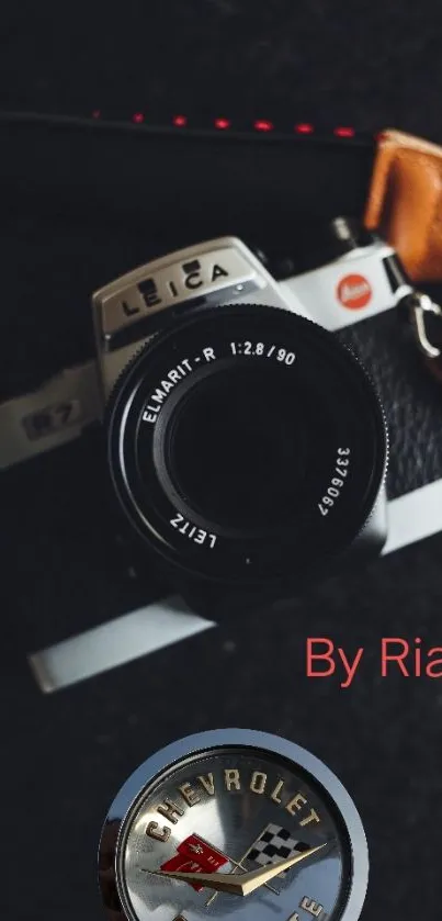 Vintage Leica camera with Corvette emblem in wallpaper.